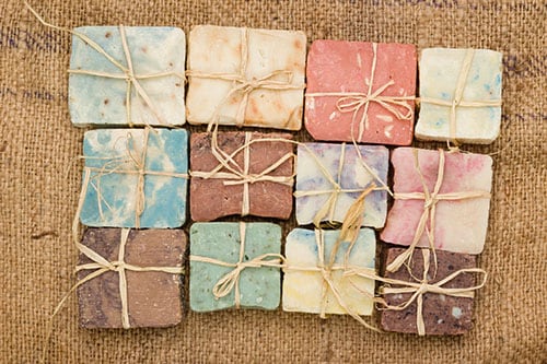 variety of natural bath soaps from princess cays with different colors and scents