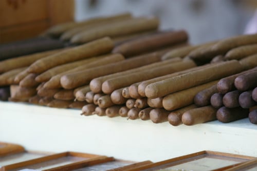 hand rolled cigars from key west piled on top of each other 