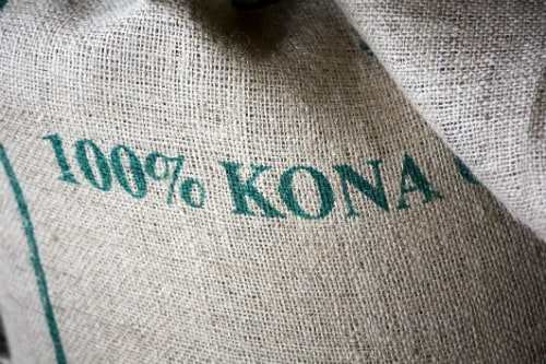 jute bag holding 100% kona coffee from hawaii
