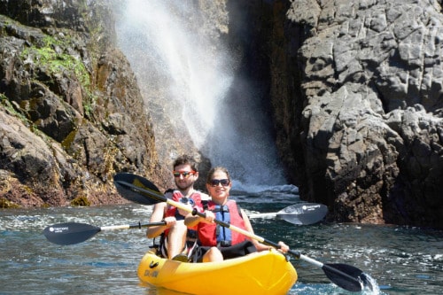 man and woman kayaking near la bufadora in ensenada