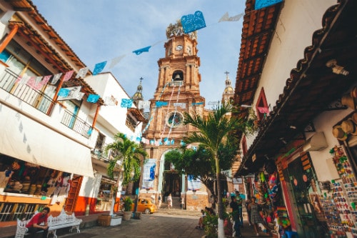 souvenir shops on the street in front of the famous church in puerto vallarta 