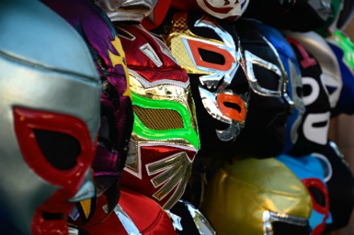 rows of mexican lucha libre masks in a variety of colors
