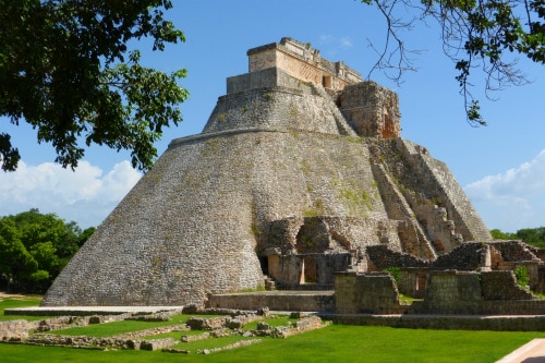 ground view of the pyramid of the magician in uxmal mayan ruins 