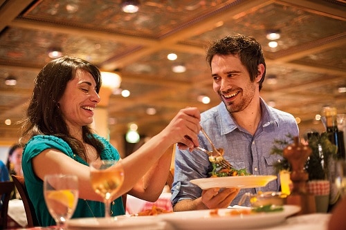couple enjoying a meal in cucina del capitano on a carnival cruise