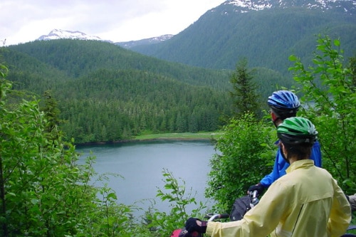 couple gazing at the forest view during a biking tour in sitka 