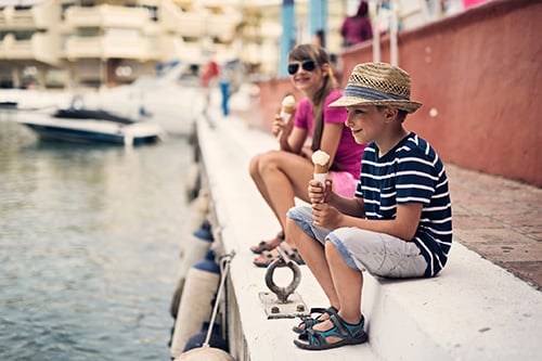 siblings eating ice cream in inner harbor baltimore 