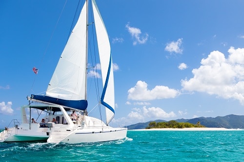 visitors sailing on a catamaran off the coast of freeport bahamas