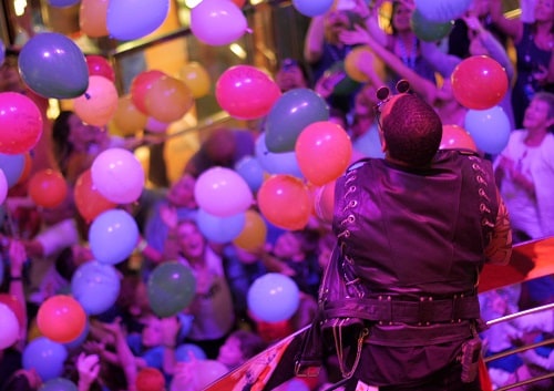 balloons dropping at carnival’s atrium during new year’s eve party 