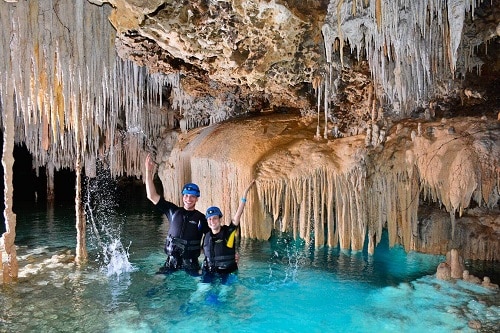 a couple enjoying the caves in the amazing secret river 