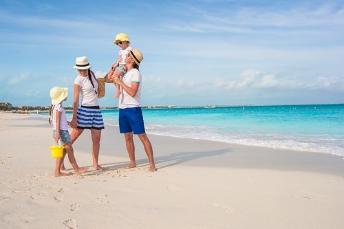 family having fun in a beach in the bahamas 