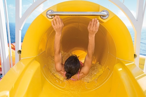 woman going down a slide on carnival spirit’s waterworks 