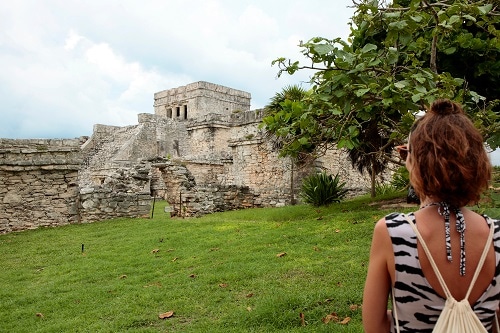 woman admiring mayan temple during a shore excursion 