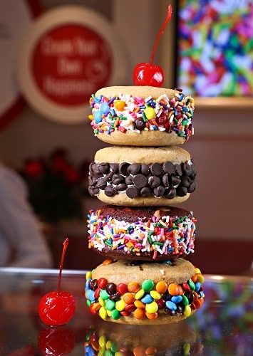 4 ice cream sandwiches stacked on top of each other with a cherry on top