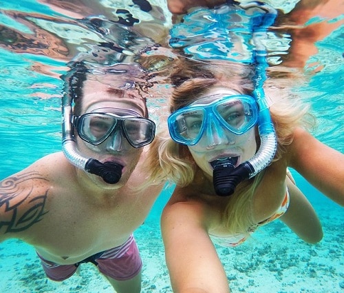 couple snorkeling in the caribbean