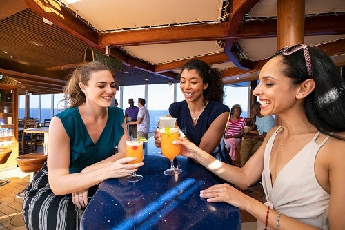 3 friends drinking cocktails at blueiguana tequila bar 