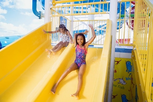 2 girls going down a water slide from waterworks onboard carnival dream 