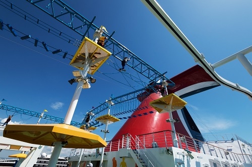 kids doing the ropes course on a carnival ship