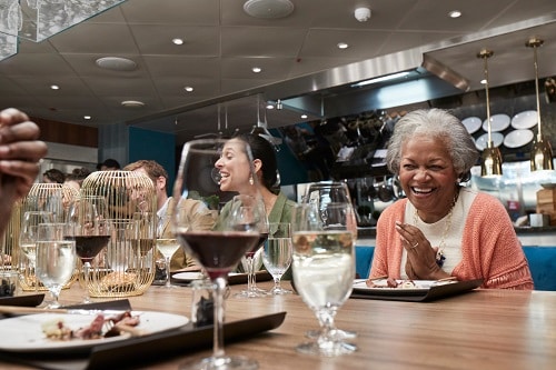 people dining at chefs table on carnival horizon