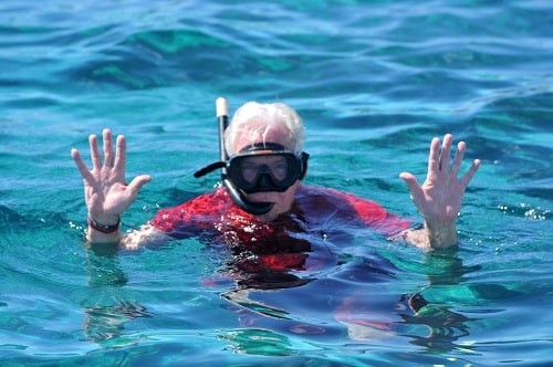 a senior man snorkeling