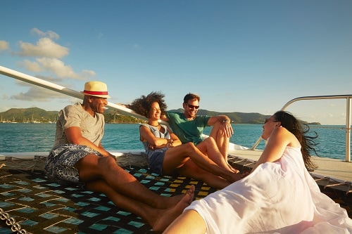 friends enjoying a luxury catamaran in the caribbean