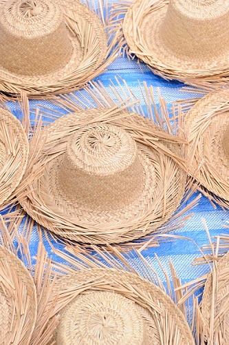 bahamian straw hats laid out