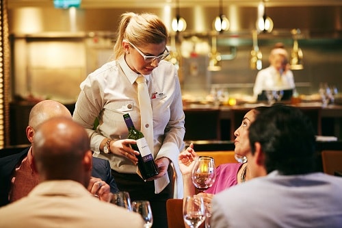 server recommending a wine to guests 