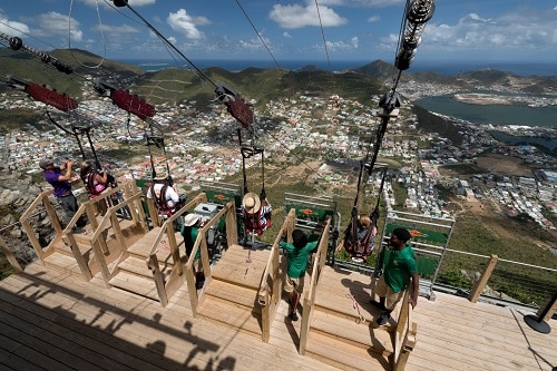travelers about to go down a zip line in st.maarten