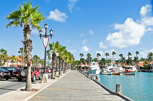 a street view of docks and boats in aruba