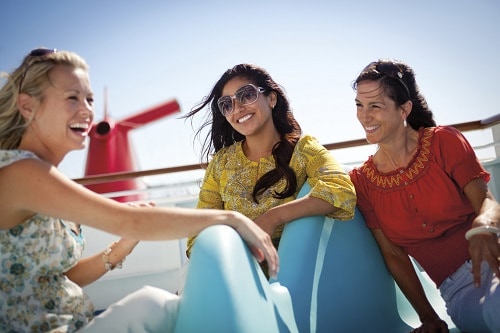three women socializing onboard a carnival cruise ship
