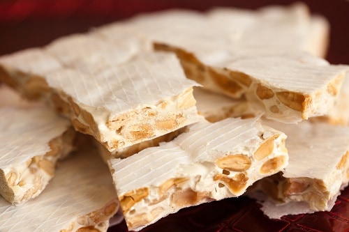 a crunchy batch of turron with almonds in them