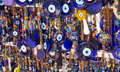 a wide variety of mati eyes at a greek marketplace