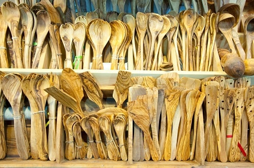 kitchenware made from greek olive wood at a marketplace in greece
