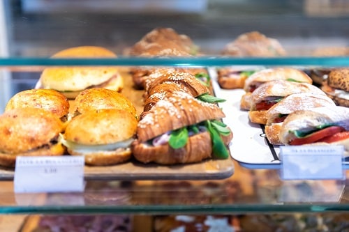 small sandwiches on display in the central market in livorno