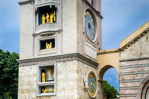 the statues on the astronomical clock tower of the cathedral of messina