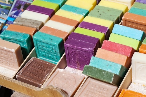 a variety of soaps from marseille, france at a marketplace