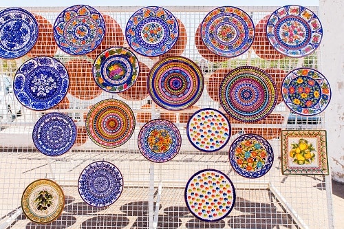 colorful, ceramic, terracotta plates at a market in portugal