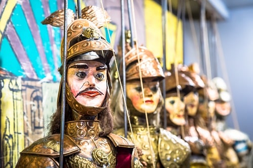 sicilian puppets for sale at an italian souvenir cart