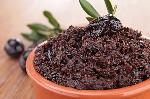 tapenade with a black olive on top