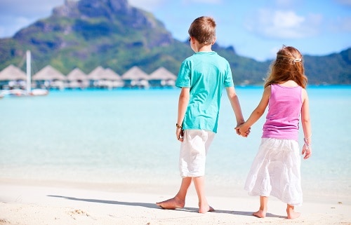 two kids at the beach on bora bora island
