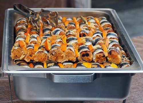 a large tray of beccafico-style sardines, ready to be served