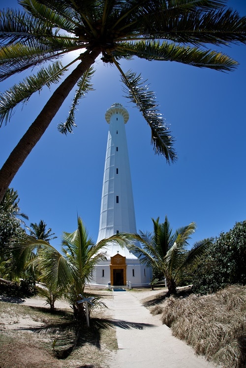 a tall lighthouse on amadee island just off new caledonia