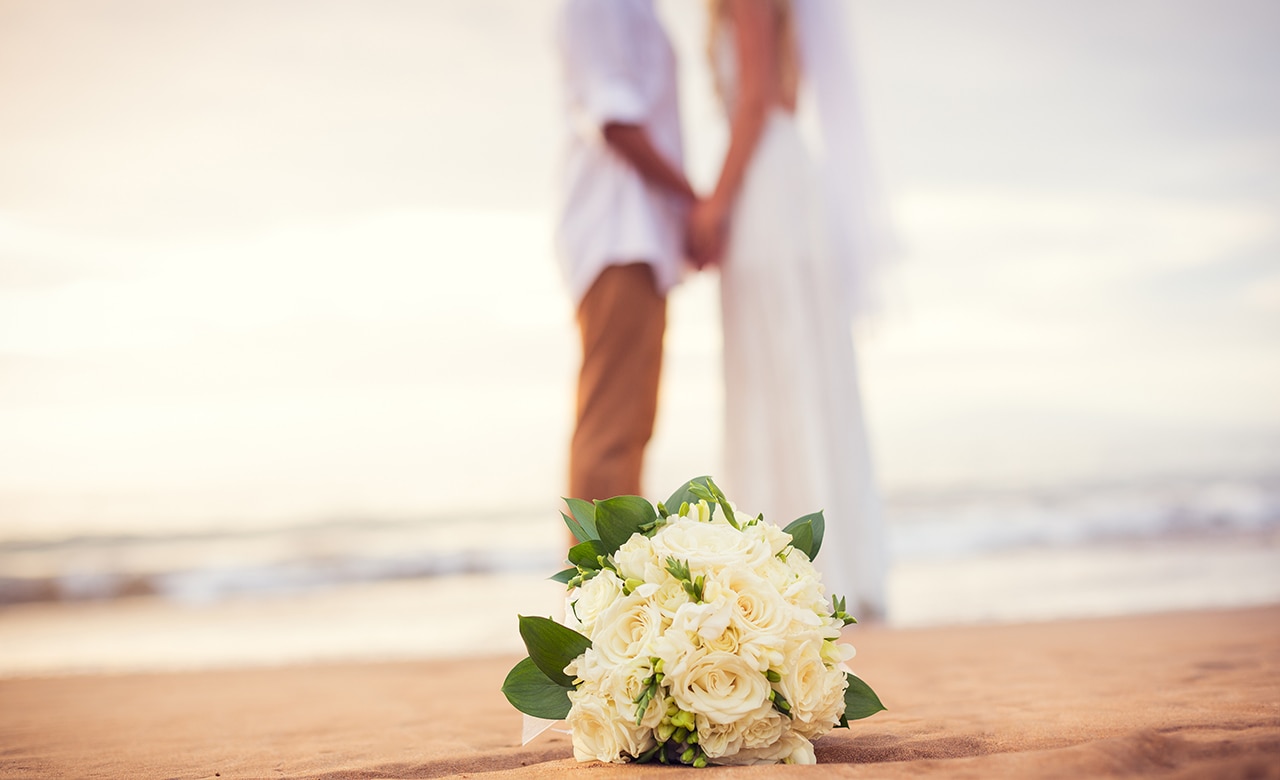 Just married couple holding hands on the beach, Hawaii Beach Wedding