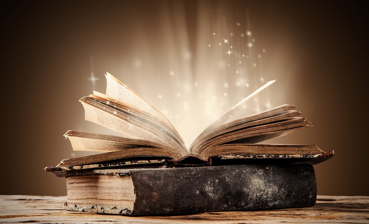 Old books on wooden planks with blur shimmer background