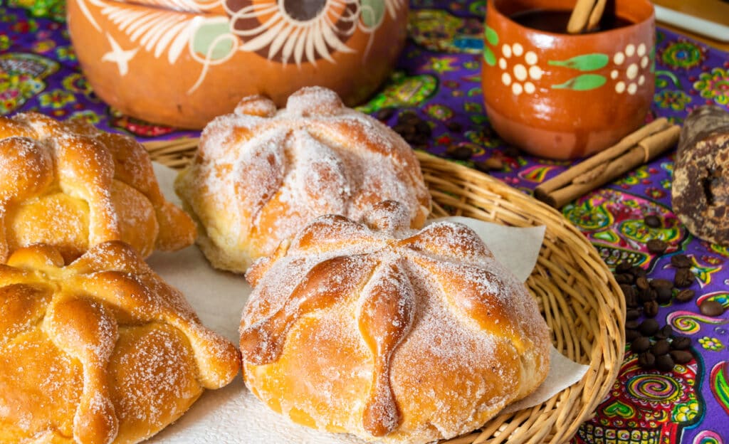 Traditional Mexican bread of the dead (pan de muerto) with coffee.