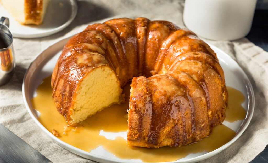 Picture of rum cake drizzled with sauce.