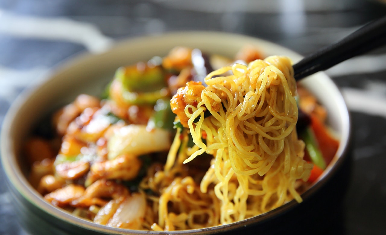 Chinese noodles with chicken and peanuts - Chinese cuisine food