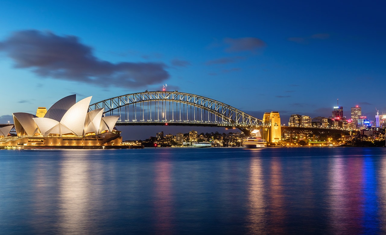 The famous Sydney opera house overlooks the harbor. 
