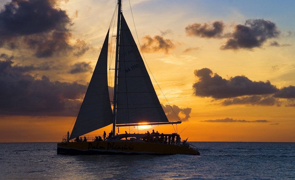 A sailboat cruise at sunset