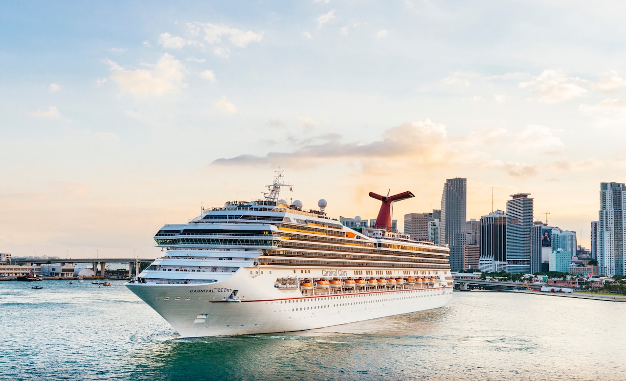 Miami, United States - November 19, 2016: A large passenger cruise ship, the Carnival Glory, turns around in Biscayne Bay as it prepares to exit the downtown Port of Miami via Government Cut.