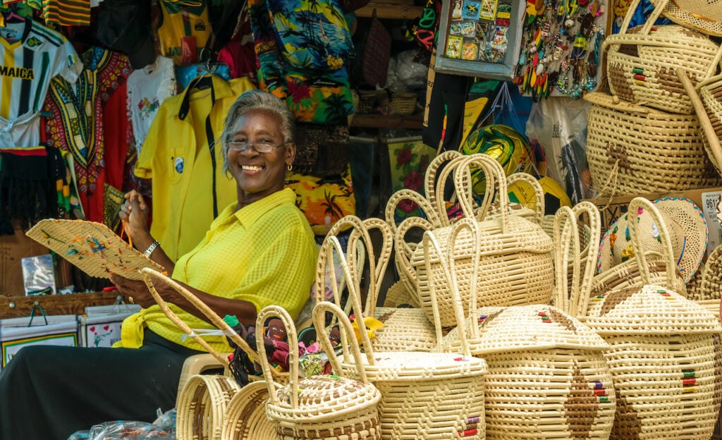 A smiling vendor selling wares in a market in Montego Bay, Jamaica.